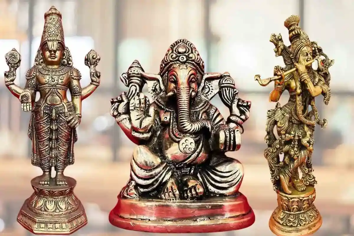 Brass idols of Hindu gods - Ganesha, Krishna, and Tirupati Balaji placed together, showcasing intricate craftsmanship and traditional design